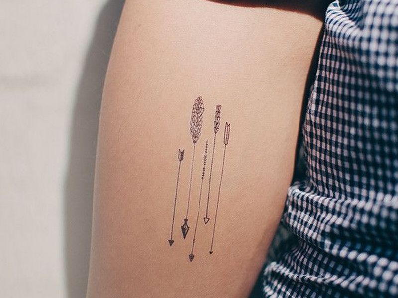 10. Arrow Tattoo Designs with Symbols for Women - wide 1