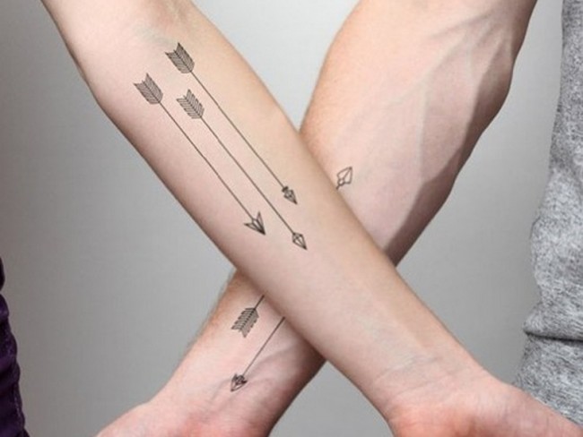 10. Arrow Tattoo Designs with Symbols for Women - wide 7