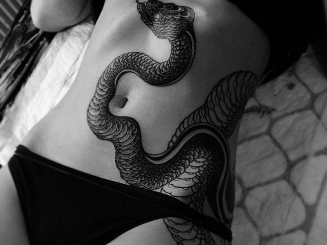 Share this post. snake-tattoo-7-650x488.jpg. 