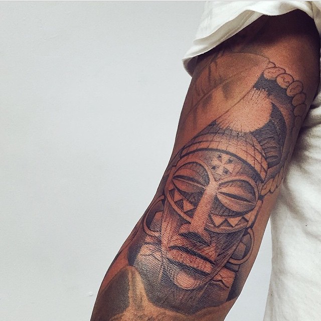 african arm tattoo