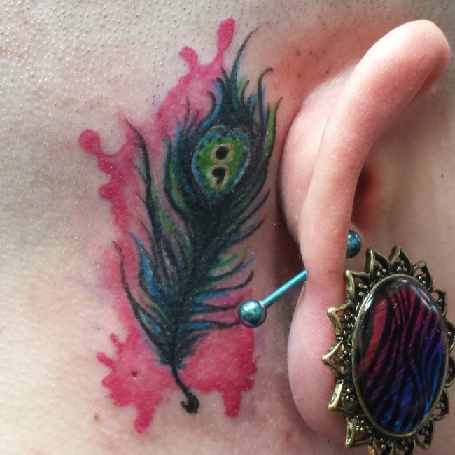 owl feather tattoo behind ear