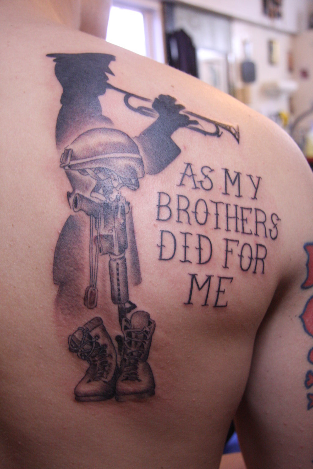 shoulder blade cross tattoos for men