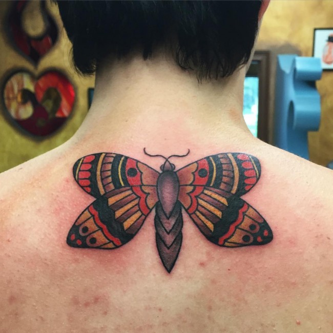 butterfly tattoo on upper back