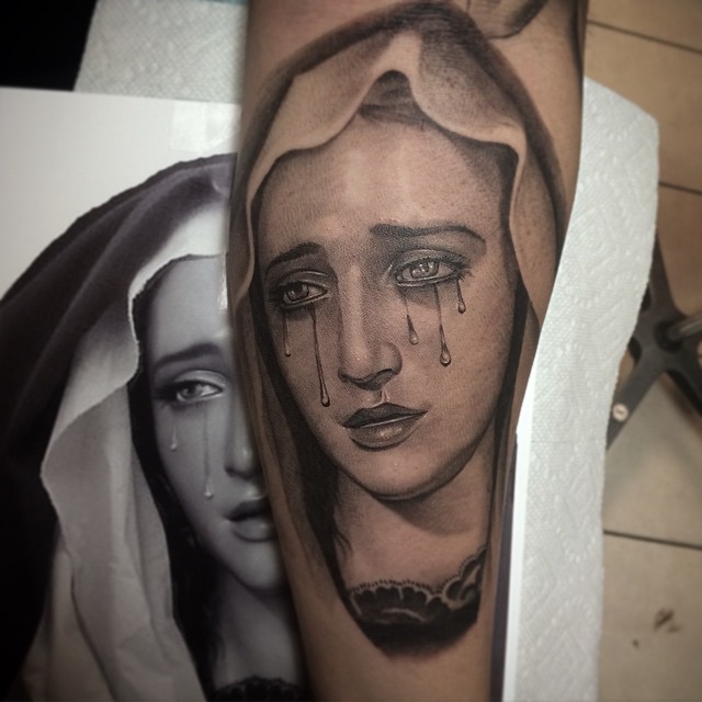 Virgin Mary tattoos.