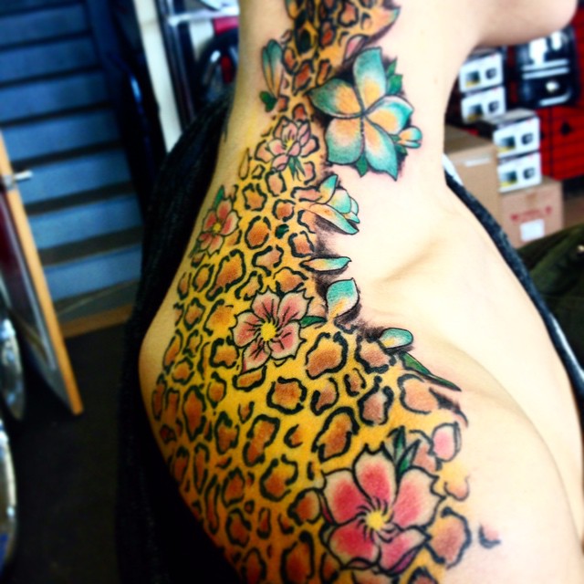 cheetah print tattoo on hip