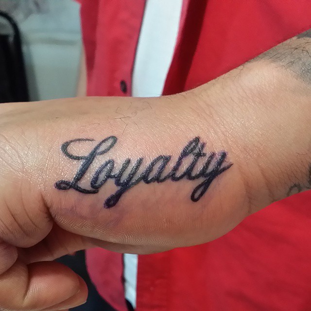 loyalty finger tattoo