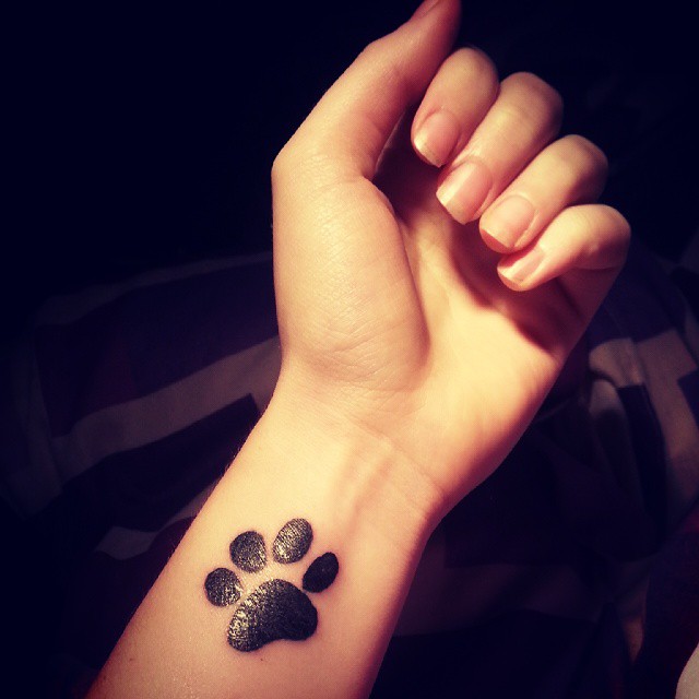 dog paw print tattoo on wrist