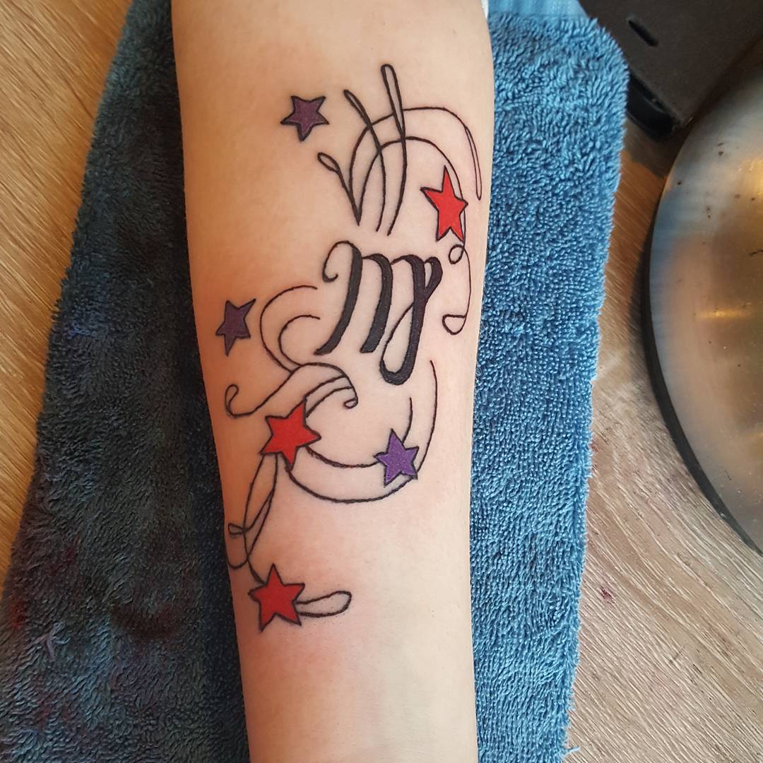 Peace sign with wings tattoo