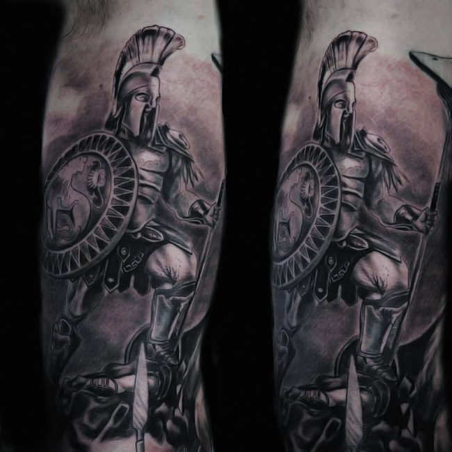 Spartan tattoo on the left upper arm, inspired by 300.